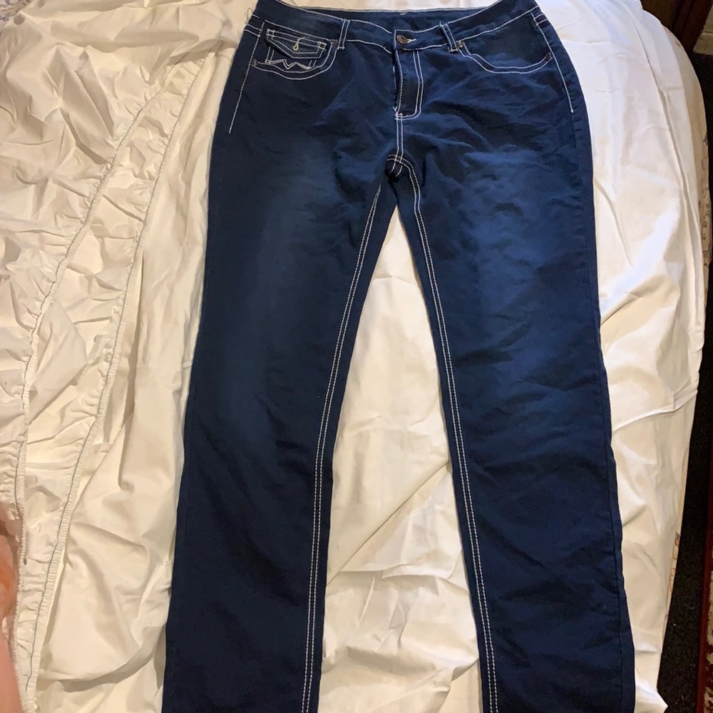 Stretchy 1x dark navy jeans with white stitch.